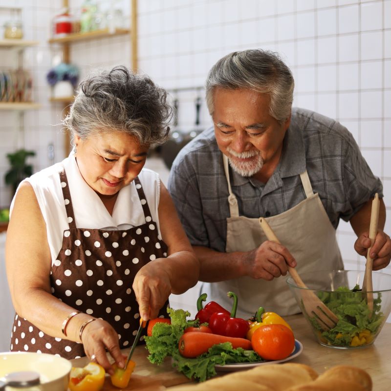 Older couple restricting their diet intake to live longer.