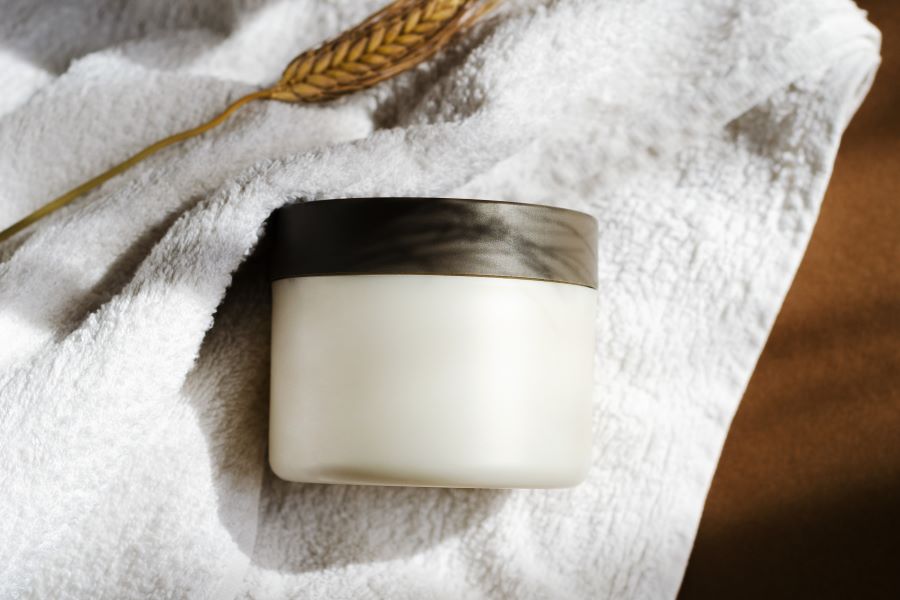 cosmetic container on towel cosmetic container on towel