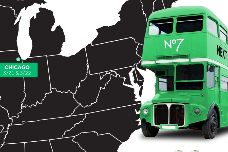 A green bus next to a map of the US with Chicago pointed out. A green bus next to a map of the US with Chicago pointed out.