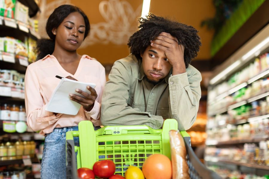 Couple Struggling During Financial Crisis Calculating Supermarket Prices Indoor Couple Struggling During Financial Crisis Calculating Supermarket Prices Indoor
