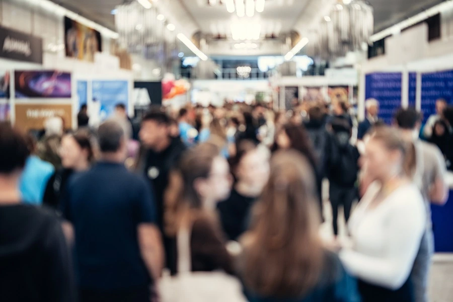 abstract blurred people at a trade show