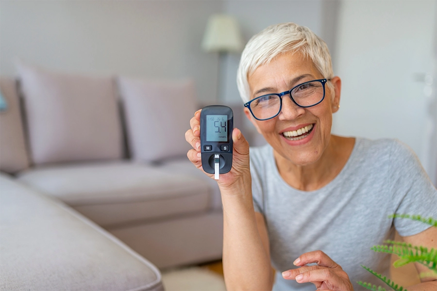 senior women doing blood sugar test at home. senior women doing blood sugar test at home.