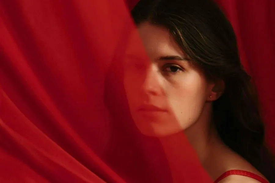 Woman behind a red veil Woman behind a red veil