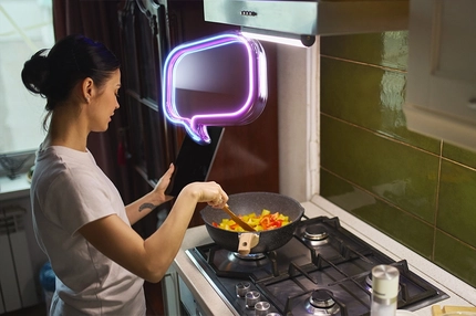 Image AI powered digital assistant displayed on tablet held by woman cooking in modern kitchen