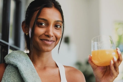 Smiling woman taking supplements