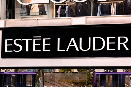 Estée Lauder logo against a building front