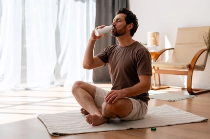 Man drinking protein shake after workout