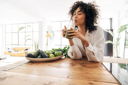 woman drinking juice-based functional beverage