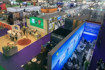 trade show floor with various booths top view