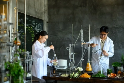 Image Two scientists extracting botanicals.