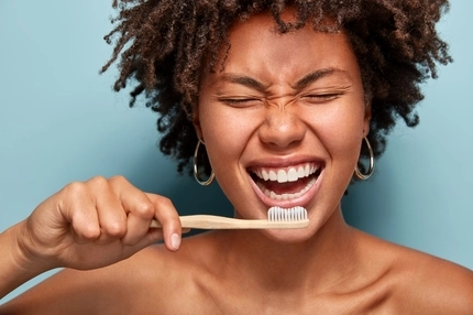 Image Person brushing teeth.