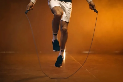 man working out with jumping ropes