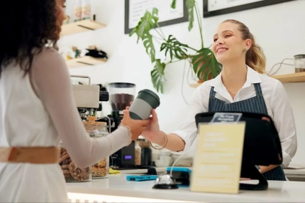 Image A person handing a cup from a customer