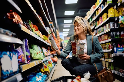 Image happy woman shopping in supermarket