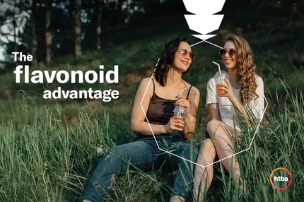 Image Banner with the women sitting on the grass with a drink