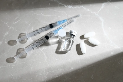 Image Glass Vials Peptide Compounds and Single Use Syringes Next to Weight Loss Pills