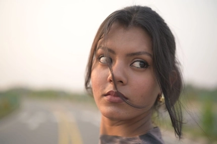 Image young woman looks off camera