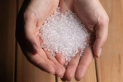 A handful of white material in hands A handful of white material in hands