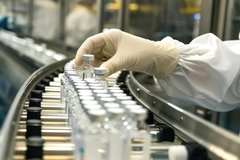 Pharmaceuticals on conveyor belt.