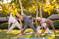 People doing yoga outside