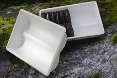 A white container with cookies in it A white container with cookies in it