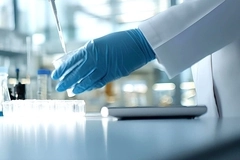 A person holding a pipette