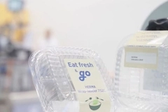 A plastic container with a label A plastic container with a label