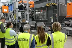 A group of people in yellow vests