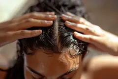 woman taking care of her scalp