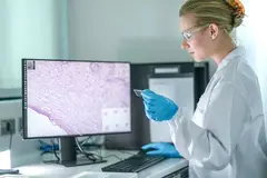 scientist looking at screen