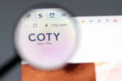 coty logo under magnifying glass on computer screen