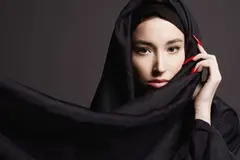 woman wearing hijab with red nails