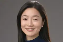A woman smiling into the camera