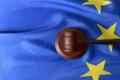 A gavel on top of the EU flag.