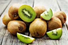 bunch of kiwifruits on wood