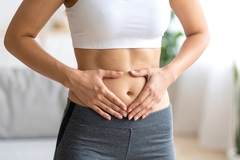 Woman holding her belly
