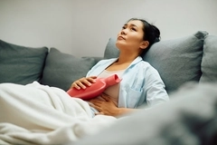 Woman with stomach pain Woman with stomach pain