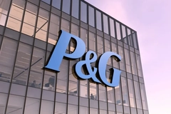 PG logo on side of a building at sunset