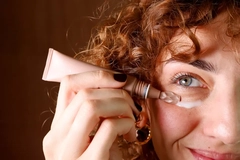woman applying skin cream
