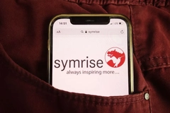 symrise logo on phone screen in pocket of pants