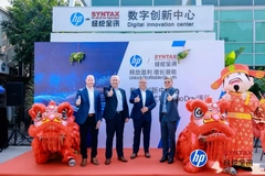 A group of men standing in front of a sign