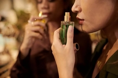 woman using perfume bottle