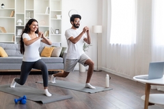 Indian couple exercising at home Indian couple exercising at home