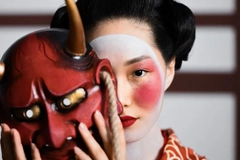 woman in traditional chinese attire holding a traditional face mask woman in traditional chinese attire holding a traditional face mask