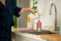 woman refilling bottle