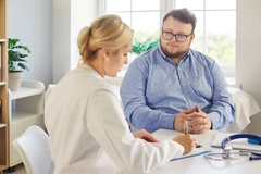 Doctor talking to overweight patient