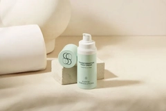 A close-up of a cream bottle