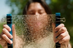 Woman hold a piece of film