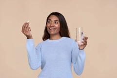 woman taking beauty from within supplement