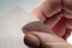 A person holding a piece of paper.